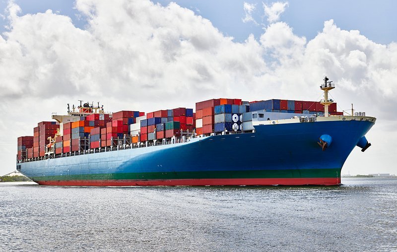 Container ship loaded with shipping containers at sea