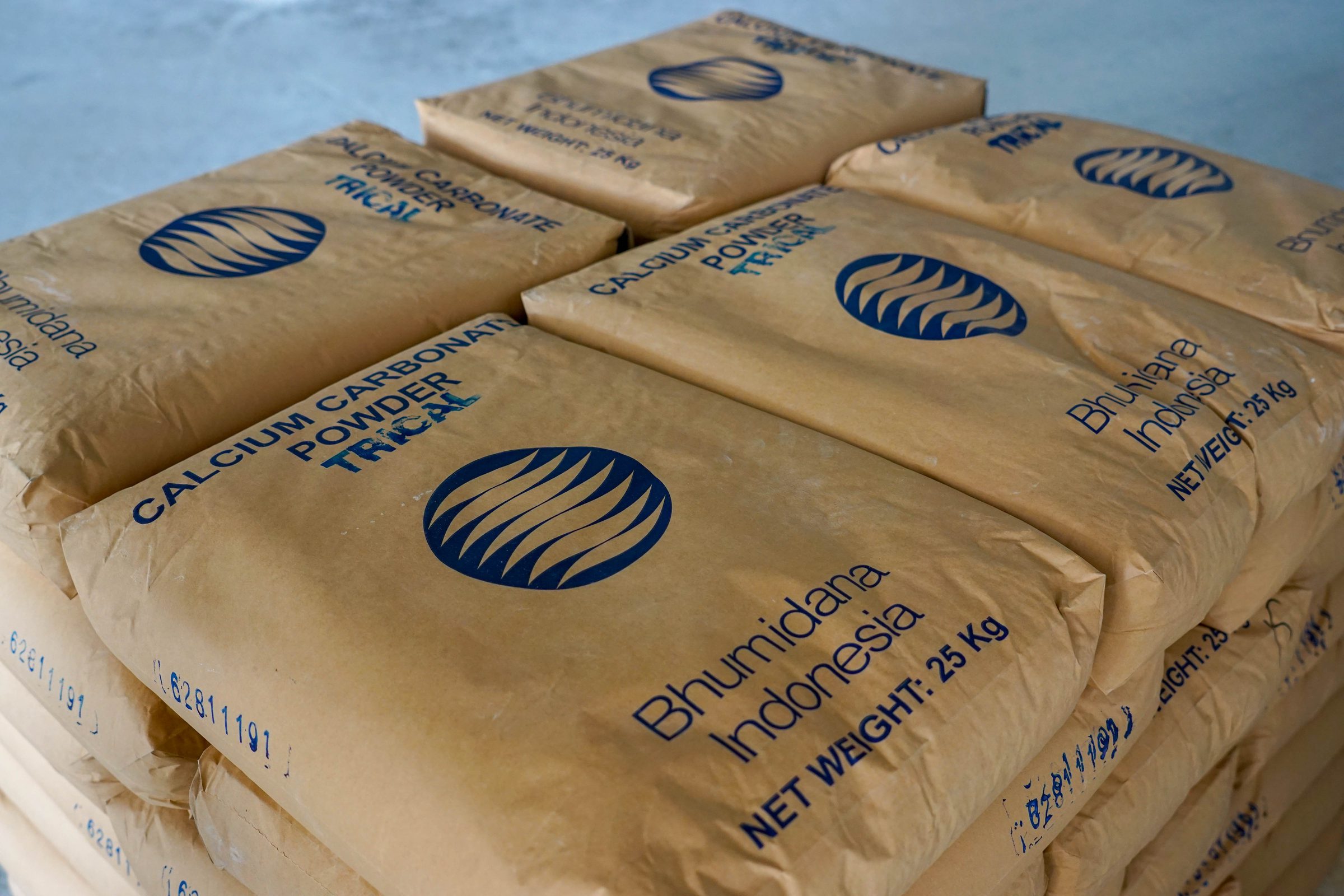 Finished product bags wrapped in plastic on pallets