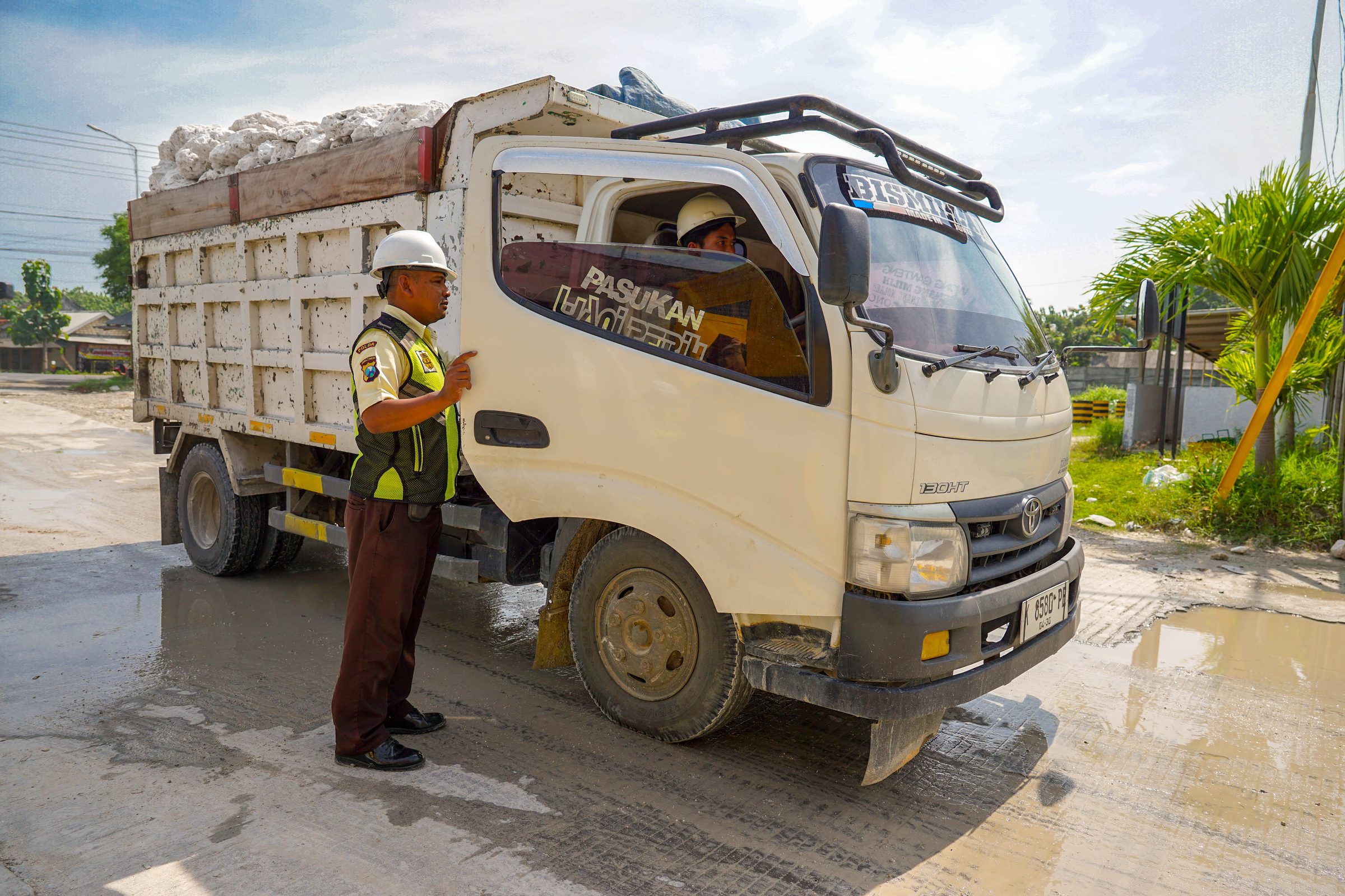 Security officer checking a truck at the gate